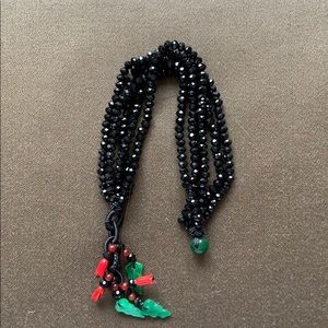 Black beads bracelet with green/red jade pieces